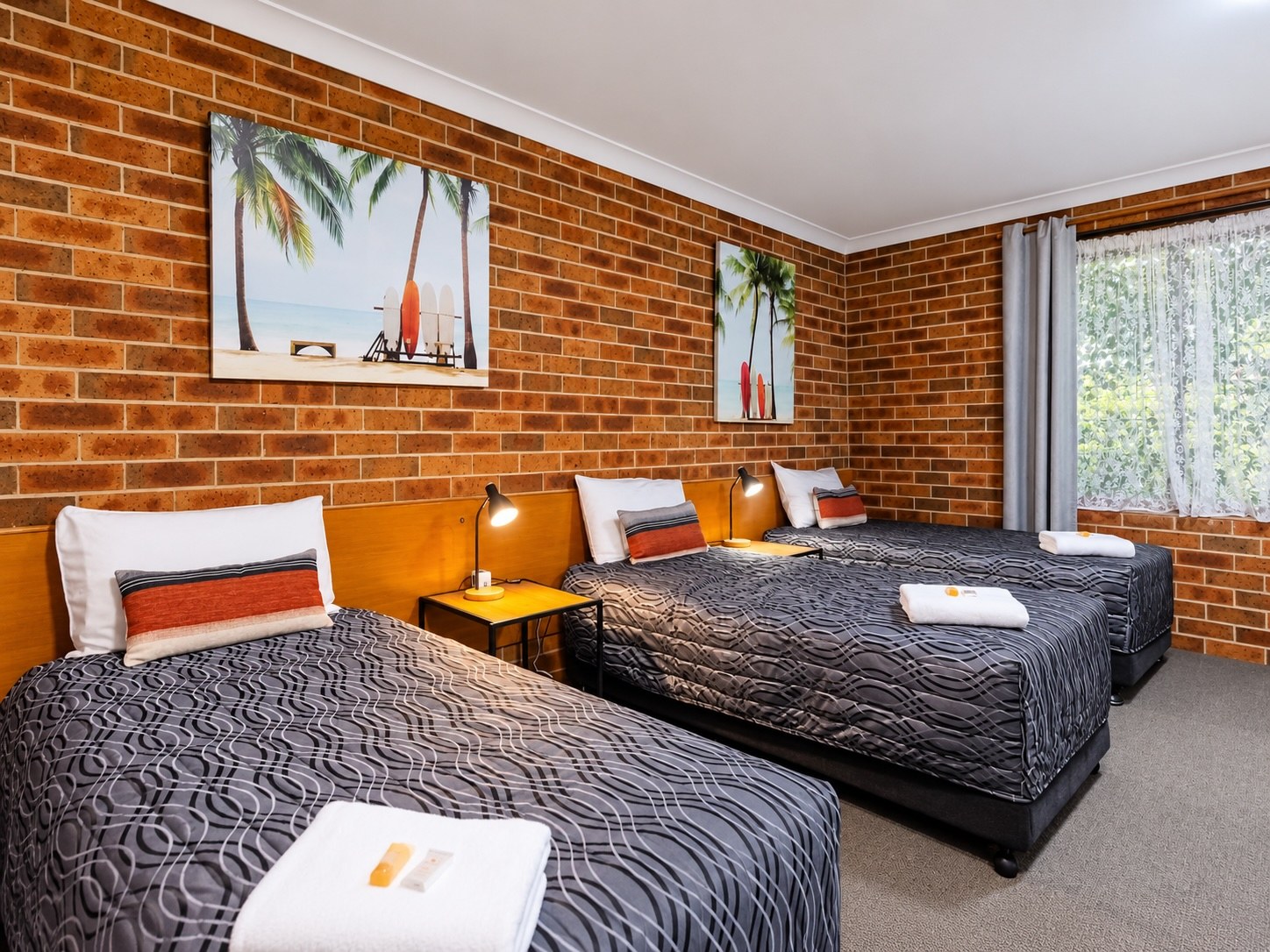 Three single beds in the Family Room at Denman Motor Inn