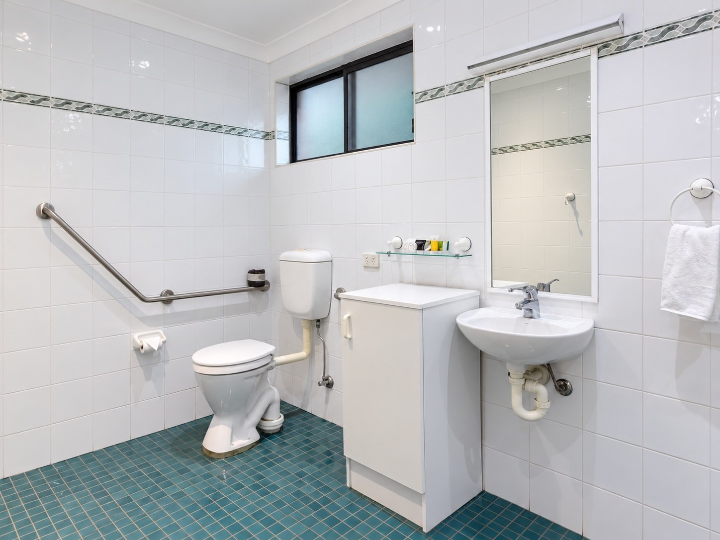 Family Room bathroom with toilet and vanity